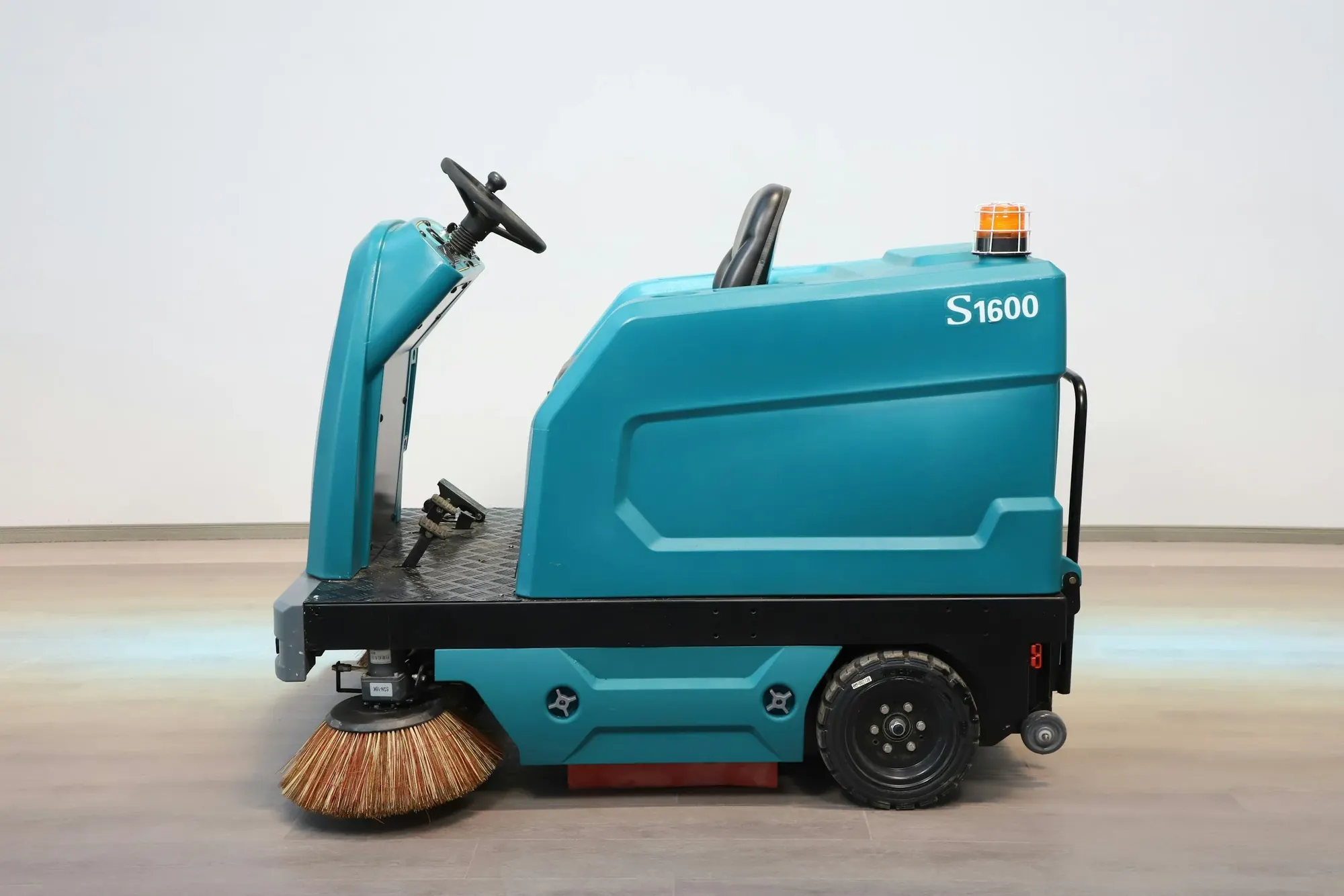An industrial floor cleaning machine