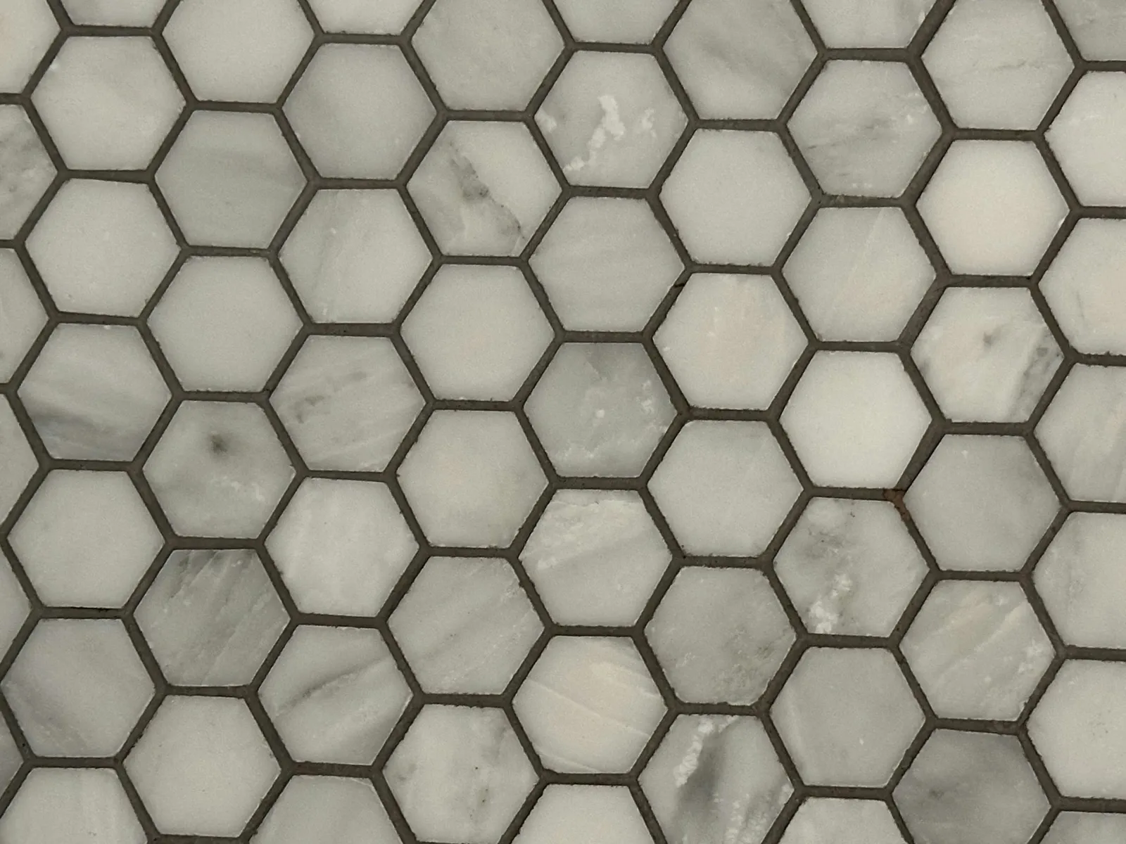 Hexagon mosaic tile with grout lines, after cleaning